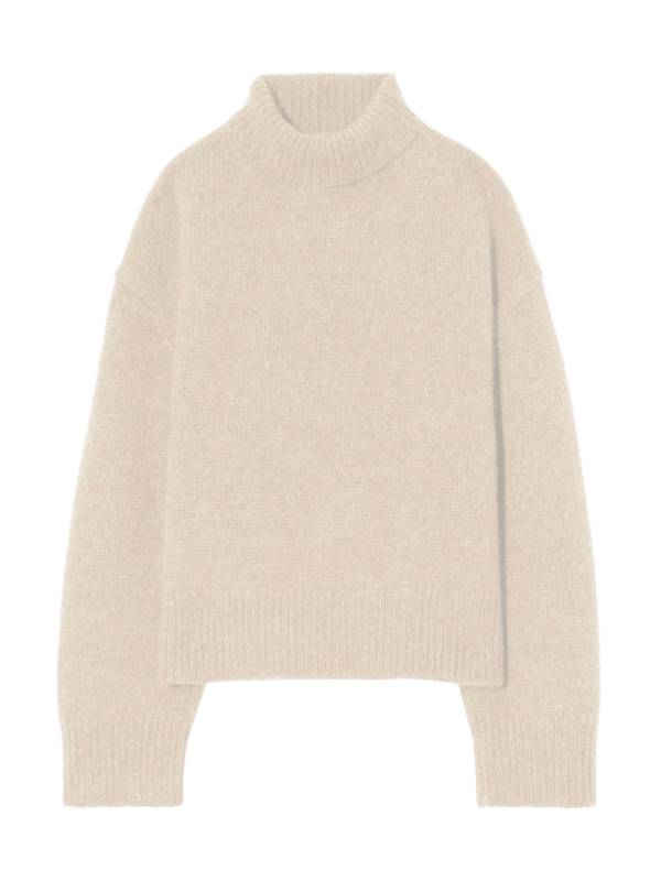 Tabitha Sweater in Beige Melange showcasing the chunky turtleneck design and dropped shoulder detail.