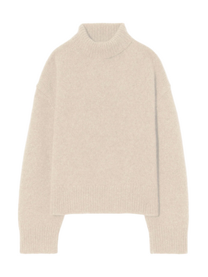 Tabitha Sweater in Beige Melange showcasing the chunky turtleneck design and dropped shoulder detail.