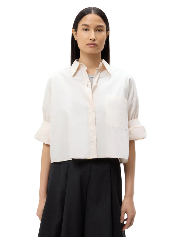 Next Ex Shirt in Pink Tint by TWP, featuring a cropped design and button-down style from superfine Italian cotton.