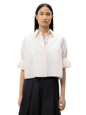 Next Ex Shirt in Pink Tint by TWP, featuring a cropped design and button-down style from superfine Italian cotton.
