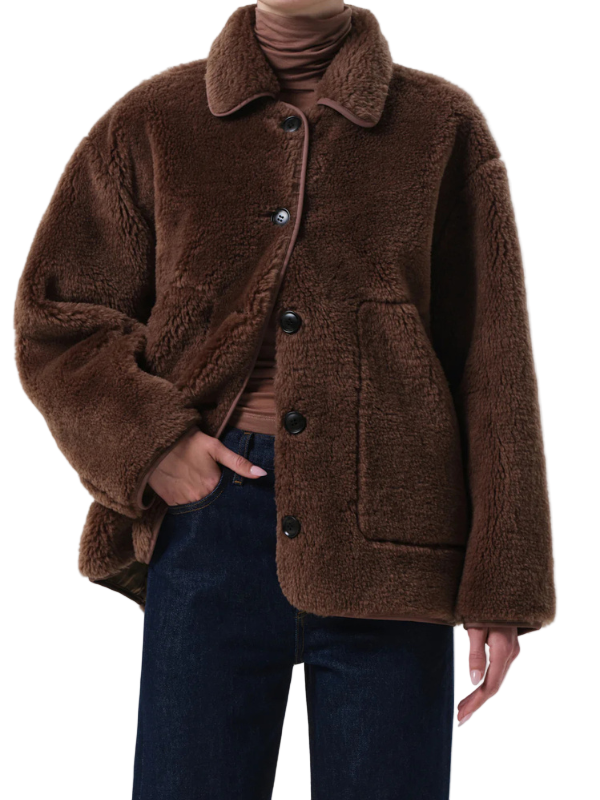 Astrid Sherpa Jacket in Warm Tan displayed on a mannequin showing off its cozy design and button front.