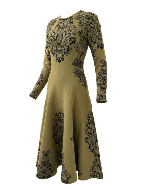 Ulla Johnson's Callista Jacquard Dress in Olive with a voluminous flared hem, showcasing rich fashion design.