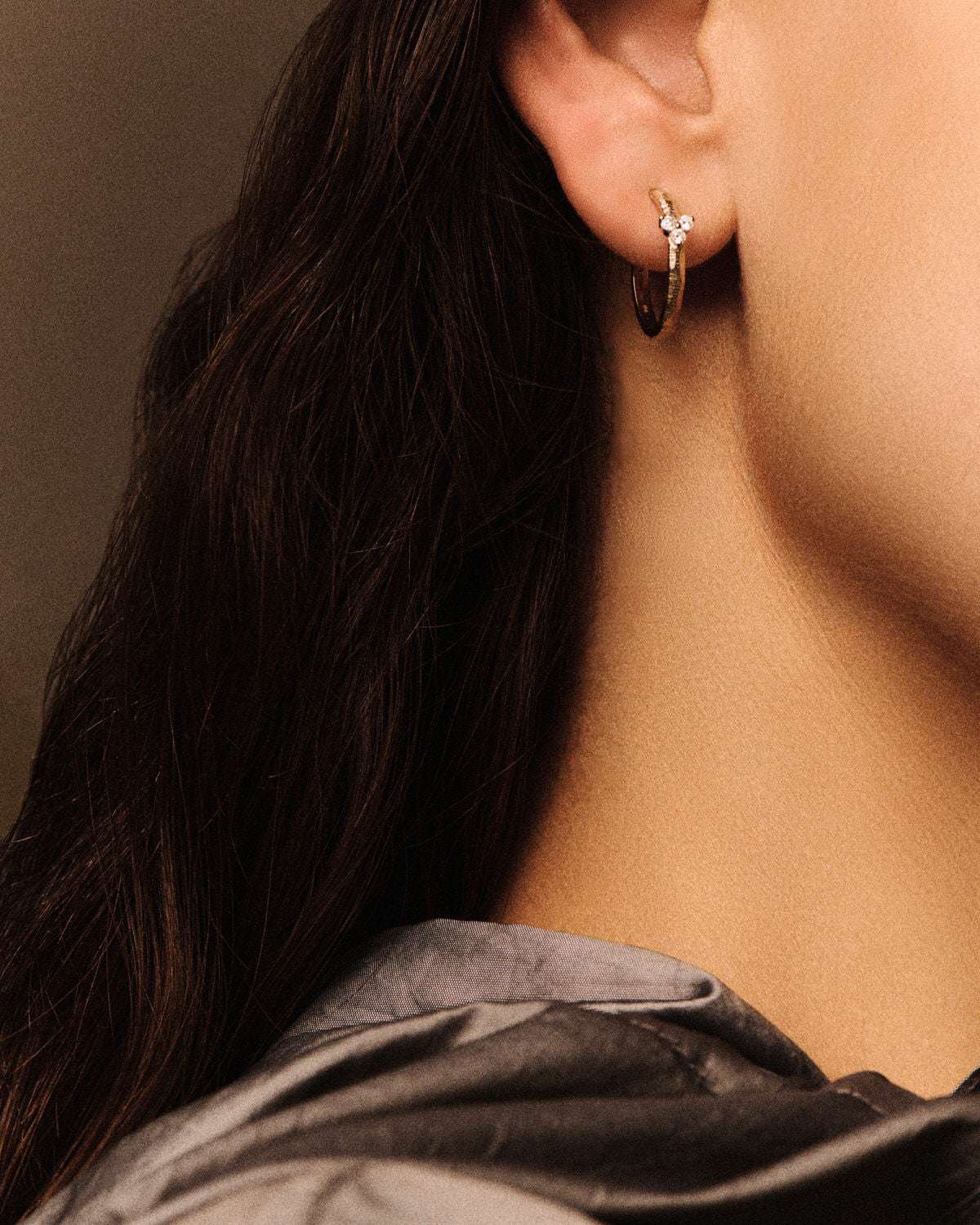 Close-up of Gaby Earring No2 in Gold highlighting the intricate design and sparkling diamonds by Pascale Monvoisin.
