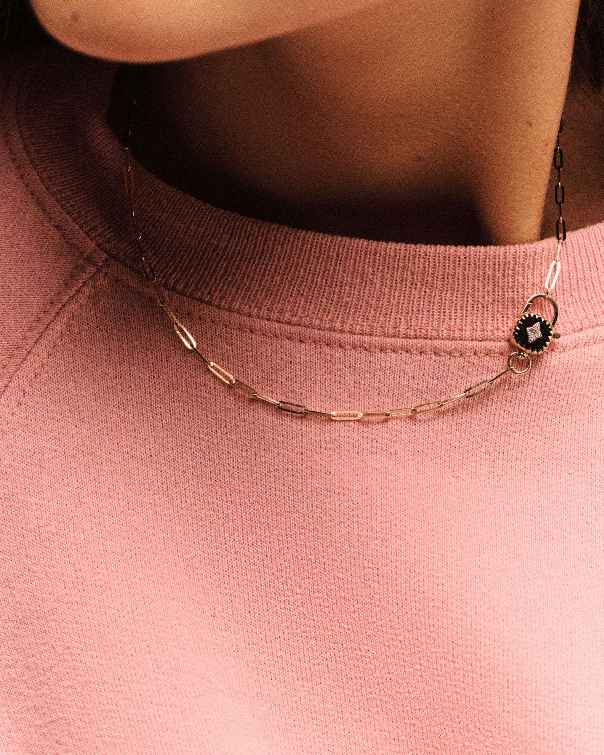 Ginger Necklace in Black displayed elegantly, highlighting its unique design and modern charm, perfect for any occasion.