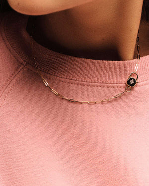 Ginger Necklace in Black displayed elegantly, highlighting its unique design and modern charm, perfect for any occasion.