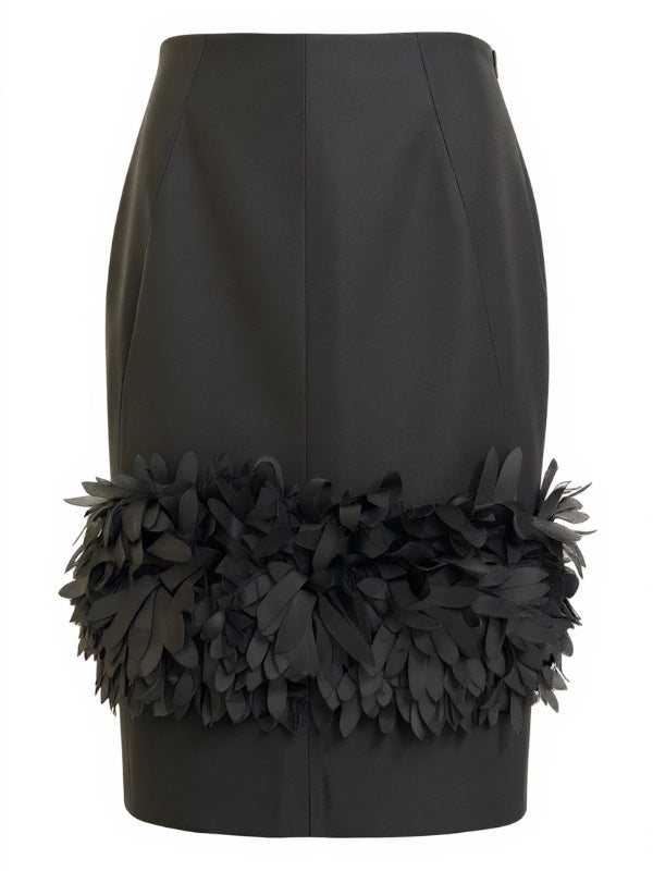 Petal Skirt in Black by TOTEME showcasing the elegant silk petals and exquisite wool-silk twill fabric.