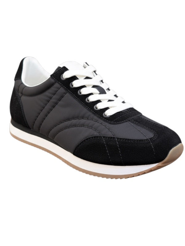Close-up view of TOTEME Sport Sneakers in Black showcasing the comfortable foam midsole and stylish suede trim.