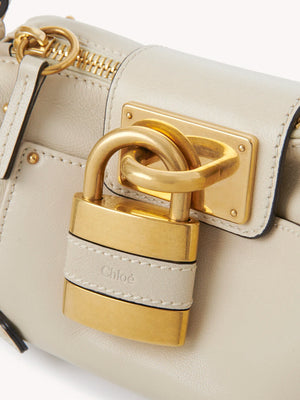 Stylish Small Paddington Chain Bag in Cloudy Cream displayed on a flat surface.