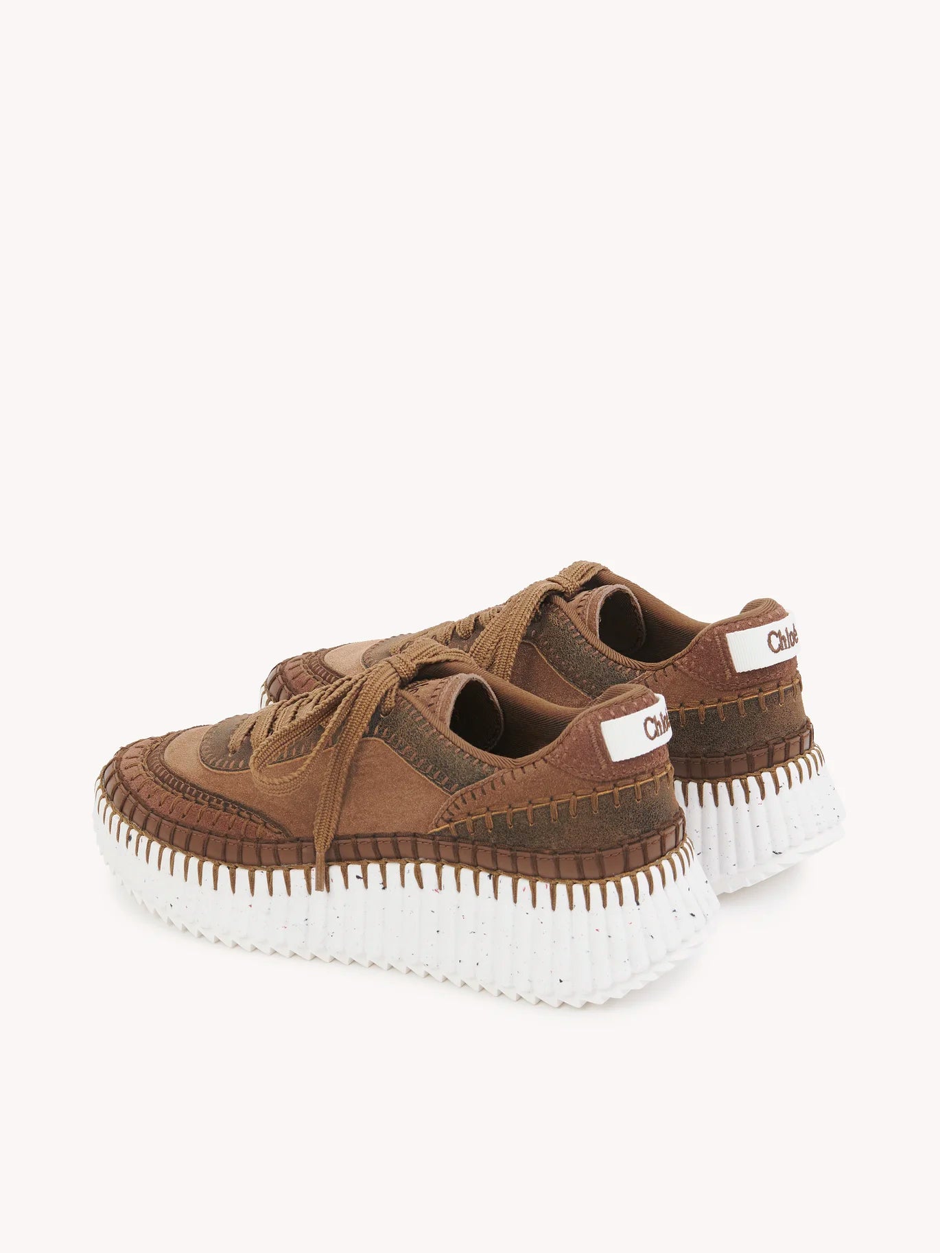 Chloé Nama Sneakers in Oak Brown viewed from the side, featuring the lightweight recycled sole.