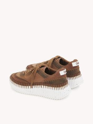 Chloé Nama Sneakers in Oak Brown viewed from the side, featuring the lightweight recycled sole.